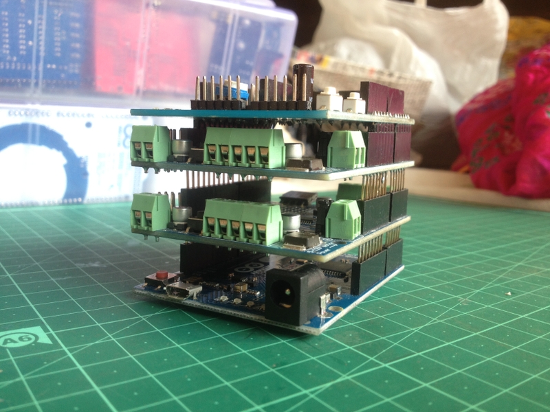 An Arduino board with three shields stacked on top.